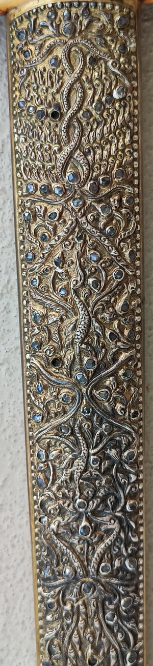 Repousse work with Inset stones on Sheath of Keris